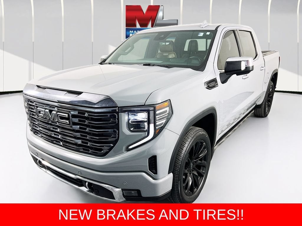 2024 GMC Sierra 1500 Denali Ultimate in Thunderstorm Gray — front three-quarter view